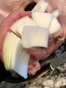 Adding in onions to a turkey