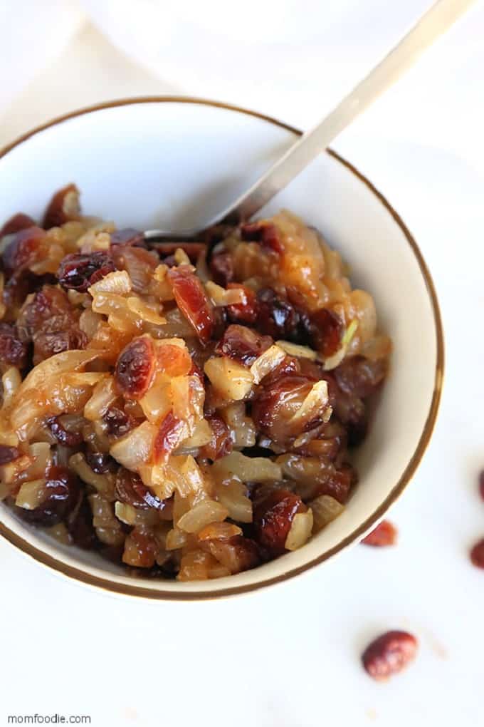 Cranberry Chutney in a white serving bowl with a metal serving spoon