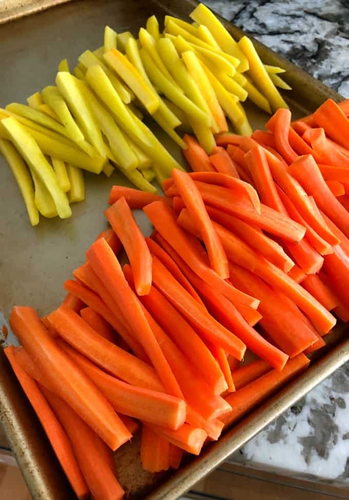 Tray full of orange and yellow carrots