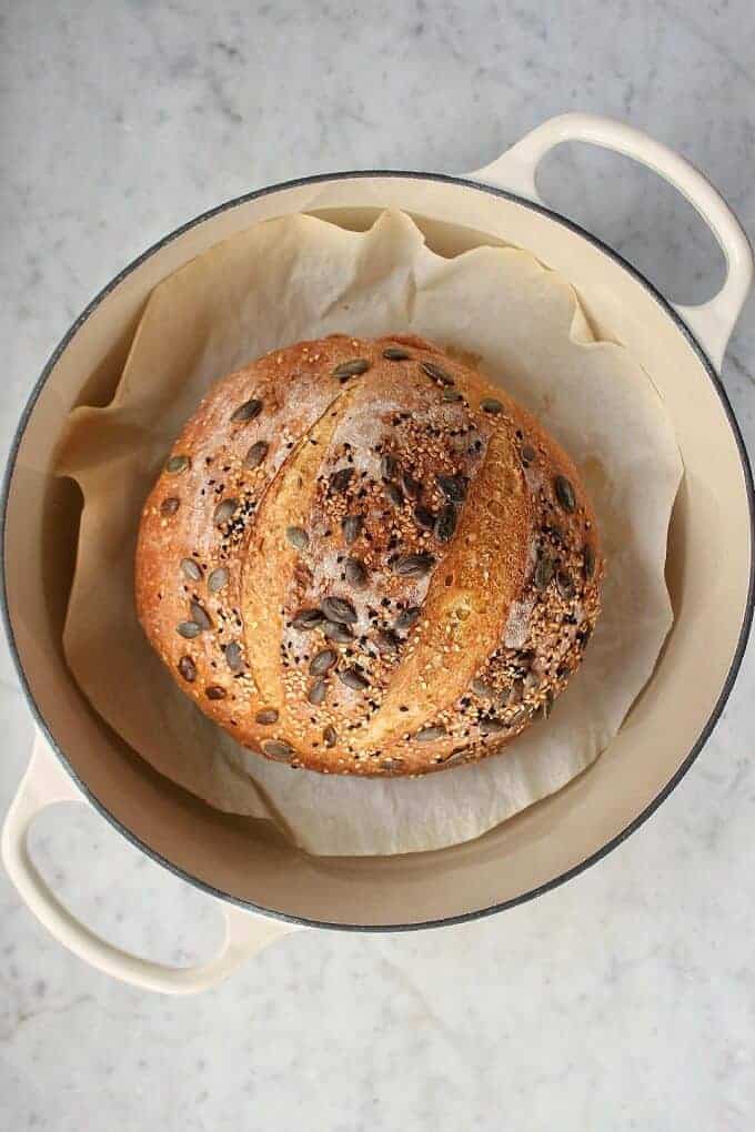 Pumpkin No Knead Bread in on parchment paper in a stock pot