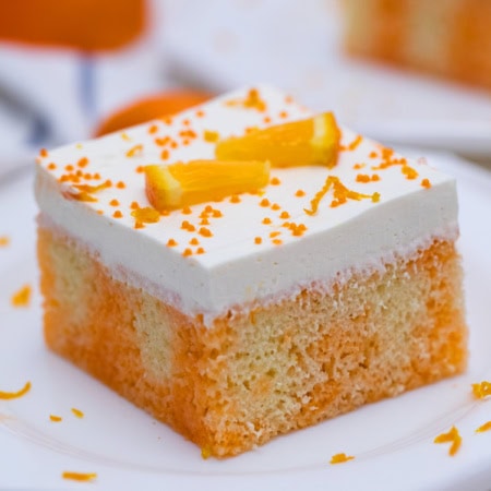 Slice of poke cake on a plate.