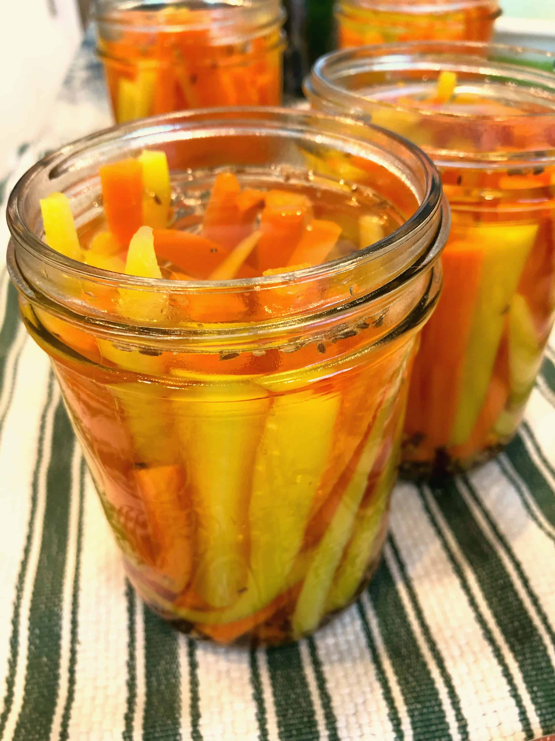 Open jar of pickled carrots