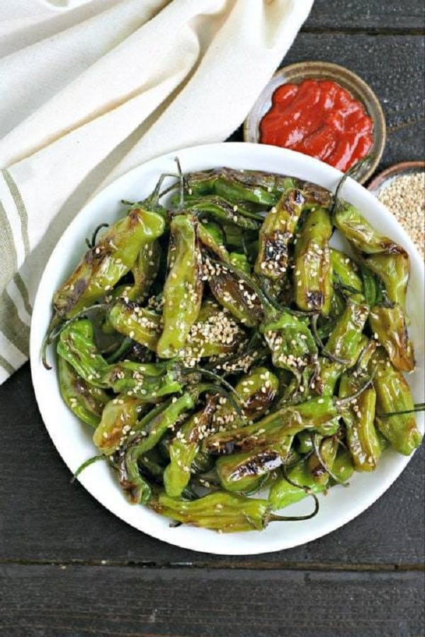 Sesame Blistered Shisito Peppers in a white bowl