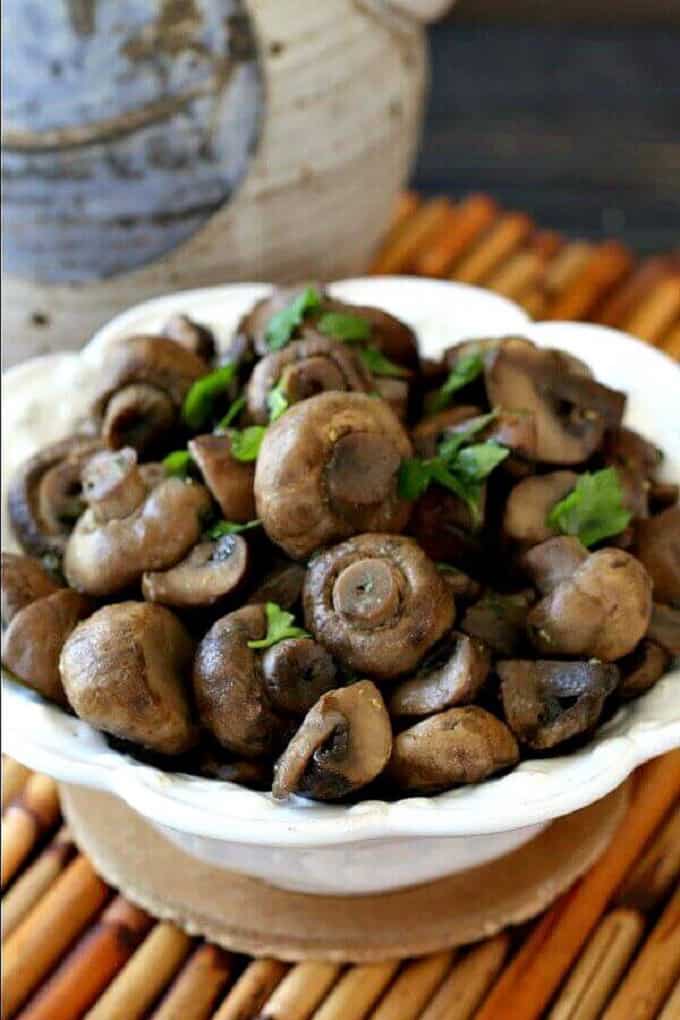 Balsamic glazed mushrooms in a white bowl 