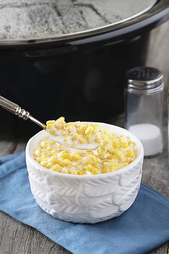 Spoonful of creamed corn for consumption.