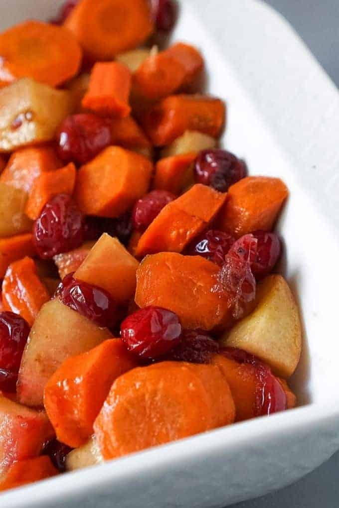 slow cooker carrots in a white serving dish