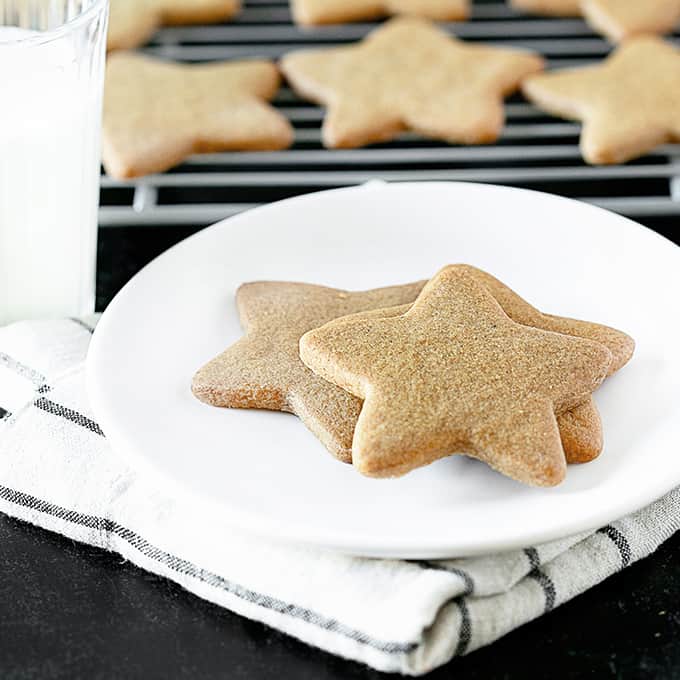 Baked star-shaped gingerbread cookies powdered with sugar for