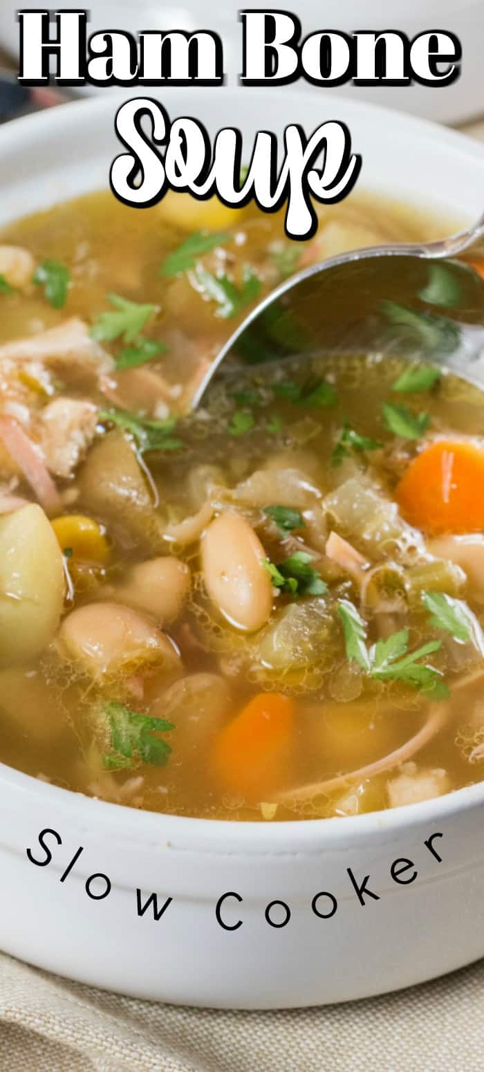Ham Bone Soup (Slow Cooker) is slowly cooked with garlic, potatoes, carrots, celery, corn and beans to give you a comforting soup and use that leftover ham bone!! #hambone #ham #soup #slowcooker