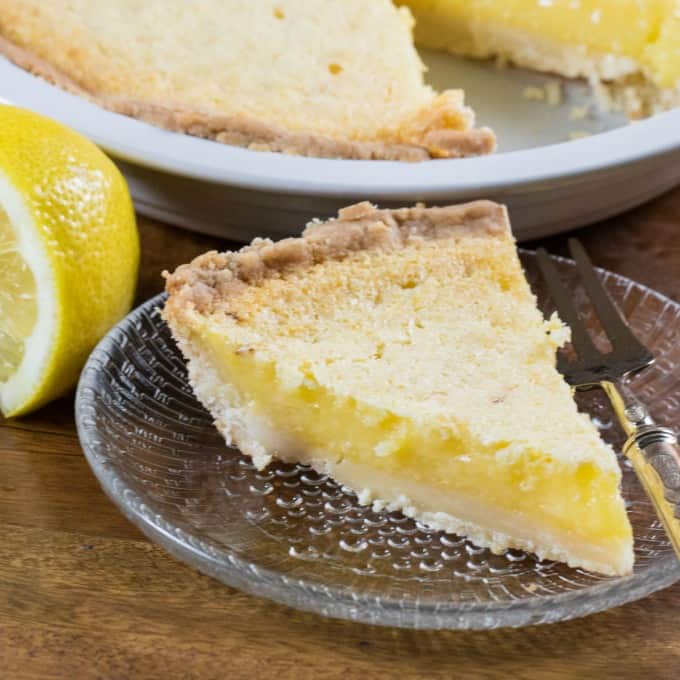 Slice of pie in a glass plate with a fork