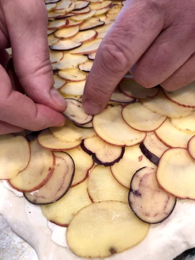 Layering potatoes on the puff pastry