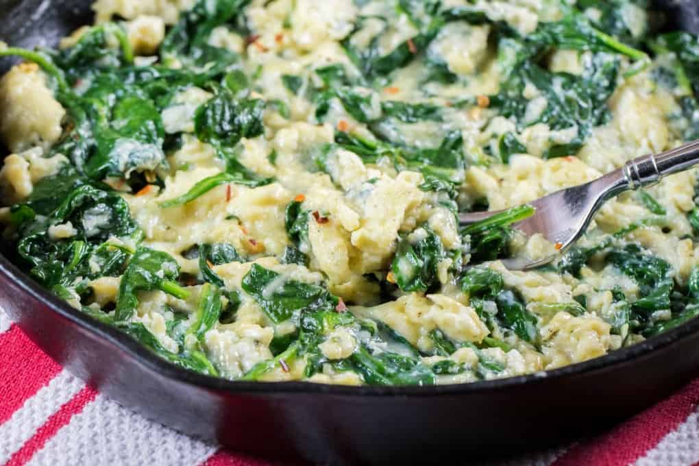 Close up shot of spinach and eggs