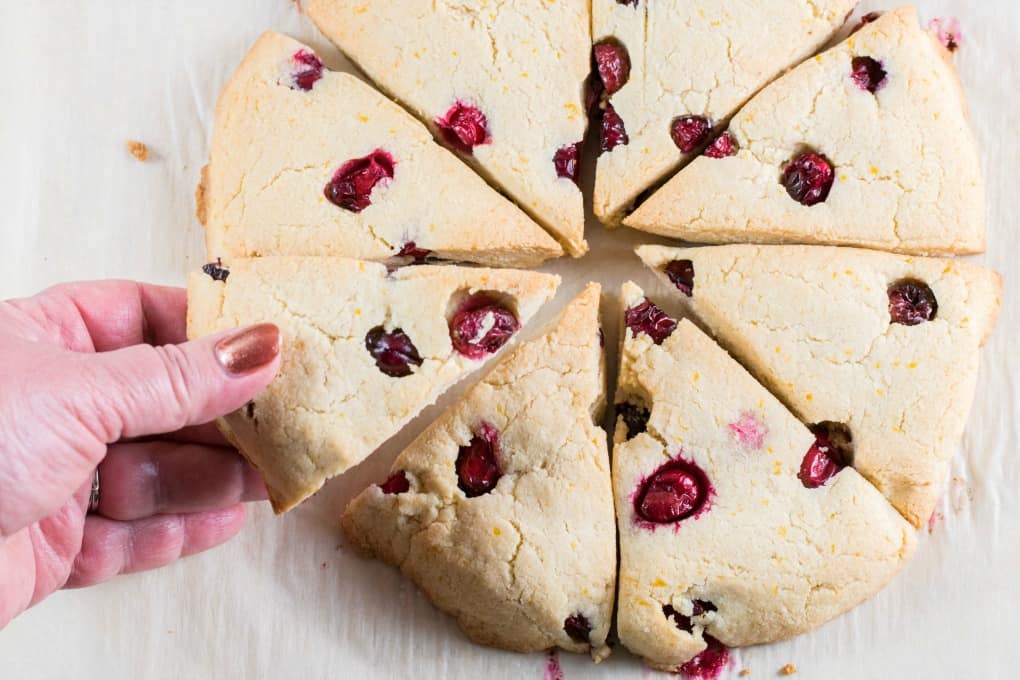 Picking up a scone from a circle of scones