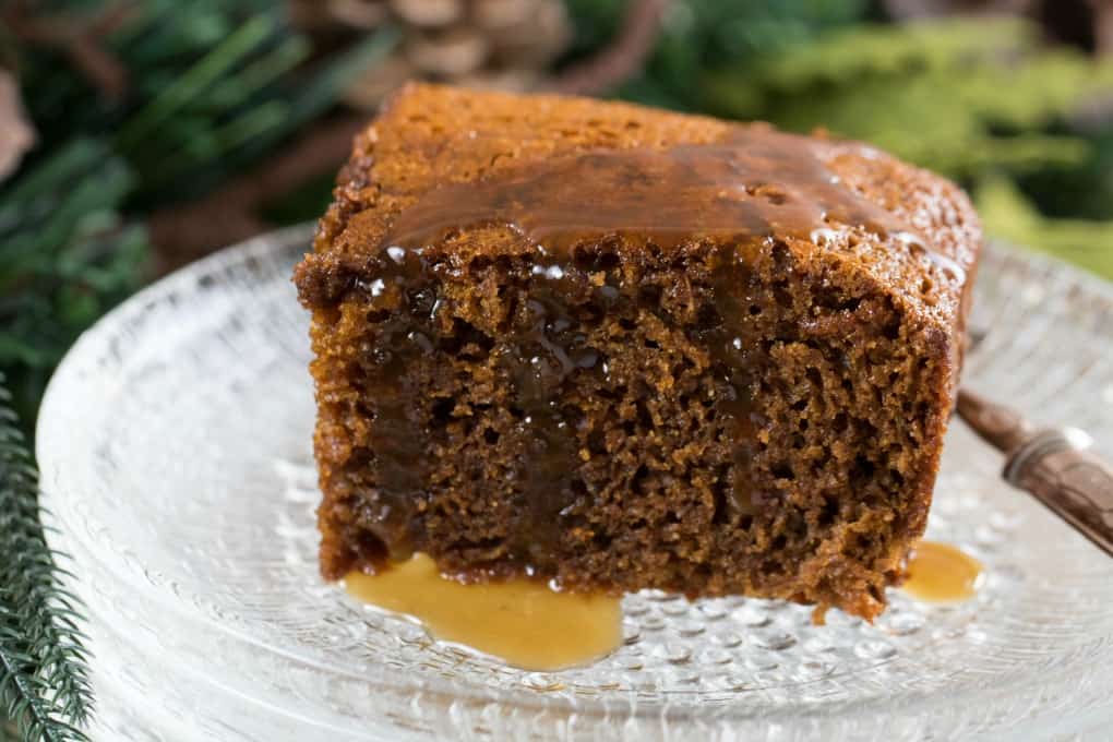 Close up of Gingerbread Cake with Calvados Caramel Sauce over top