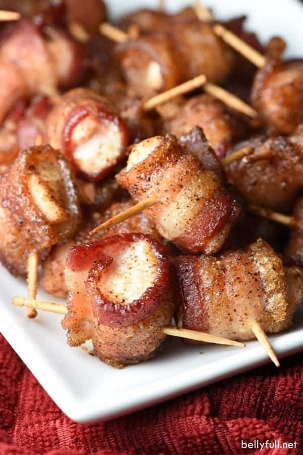 Bite size chicken bacon wraps on a white plate