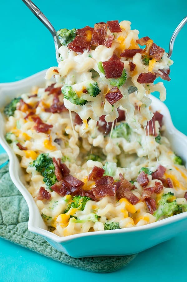 A scoop of Bacon Broccoli mac and cheese in a white serving bowl 