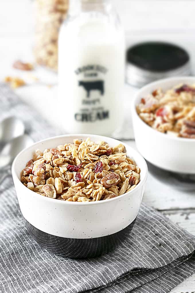 Breakfast is served in a black and white bowl, Homemade Granola.