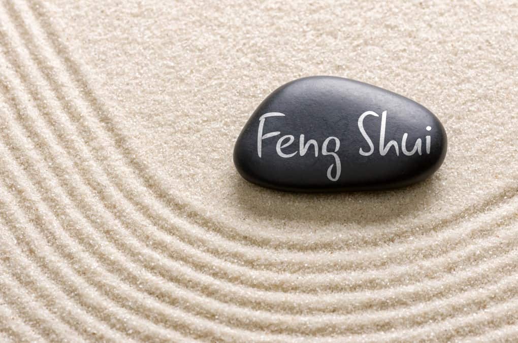 A black stone with the inscription Feng Shui