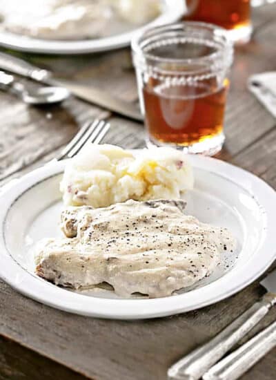 Pork Chops and mashed potatoes on a plate.