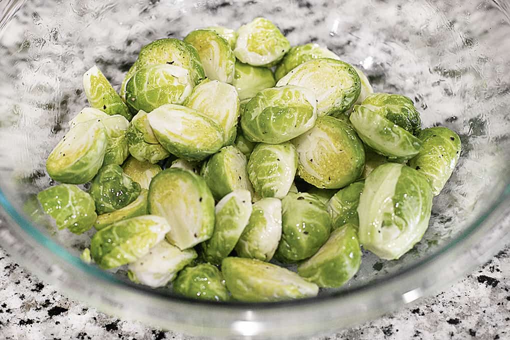 Bowl of Brussels Sprouts with Olive Oil and Seasoning