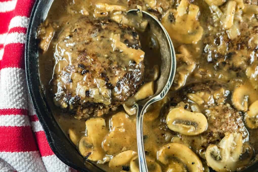 Salisbury Steak in a cast iron pan. 