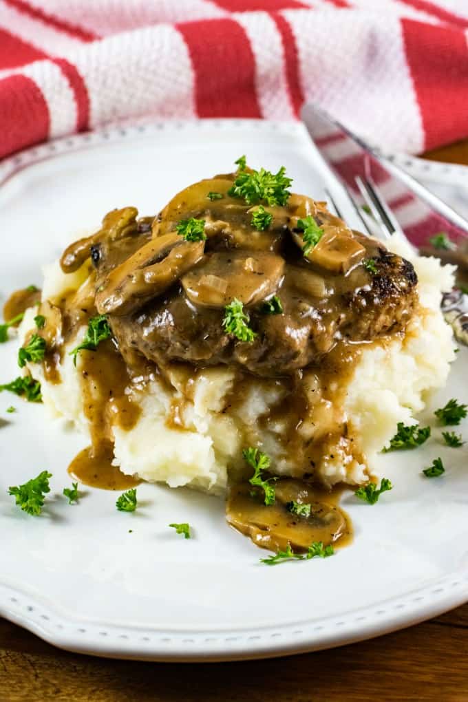 Close up of Salisbury Steak on a white plate