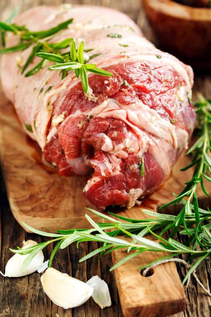 Fresh Boneless Leg of Lamb on a cutting board