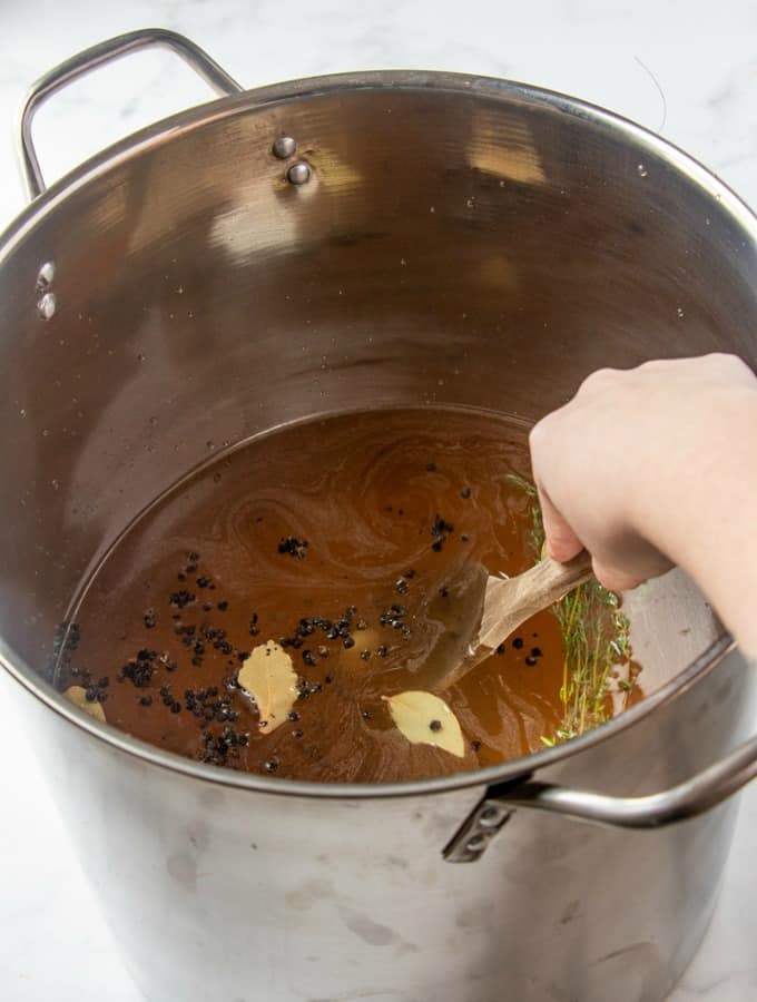 Stirring turkey brine in a pot