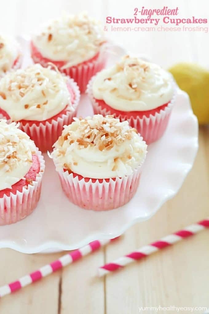 Strawberry soda cupcakes with lemon cream cheese frosting on a white plate