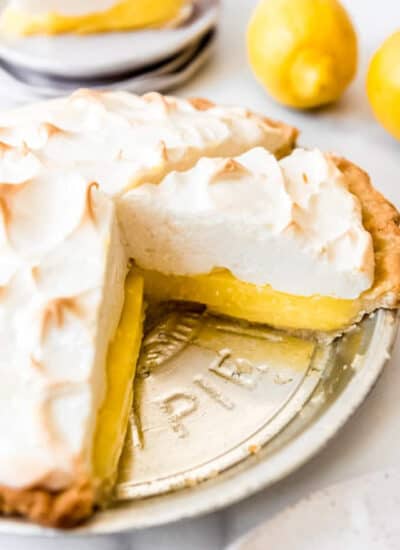 Lemon Meringue Pie - a sliced lemon meringue pie in a tin pie plate.