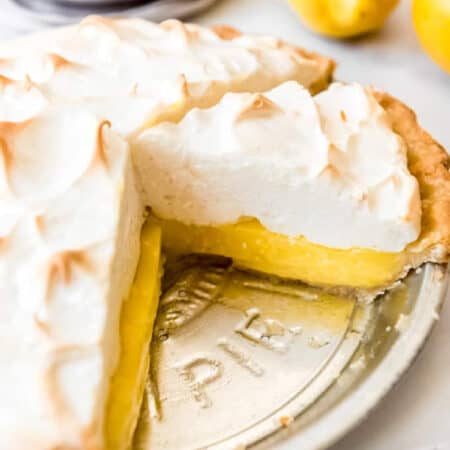 Lemon Meringue Pie - a sliced lemon meringue pie in a tin pie plate.