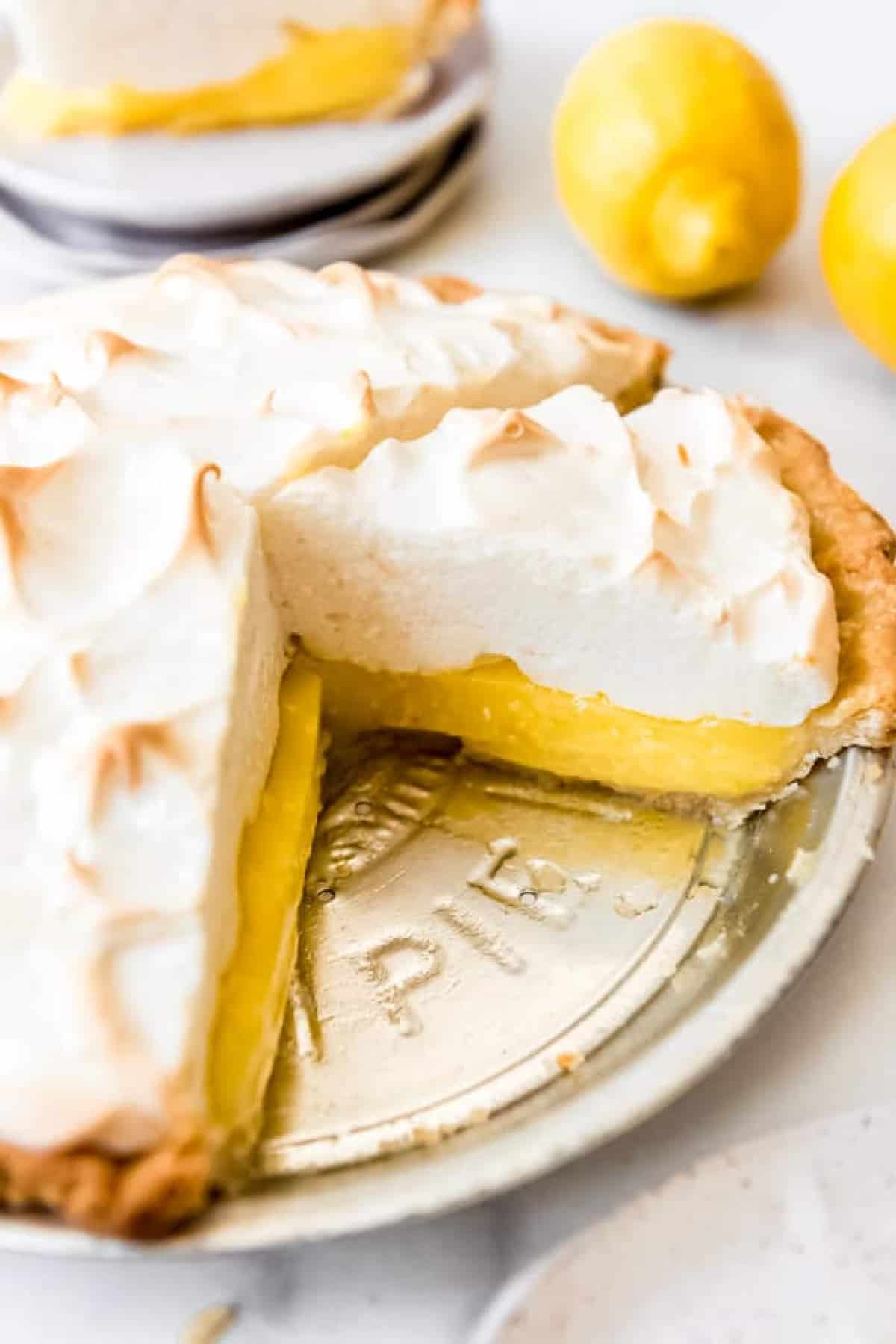 Lemon Meringue Pie - a sliced lemon meringue pie in a tin pie plate.