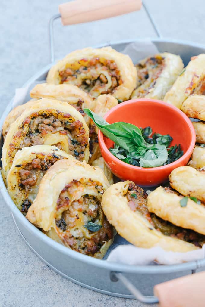 Delicious Sausage Pinwheels in a round metal bowl