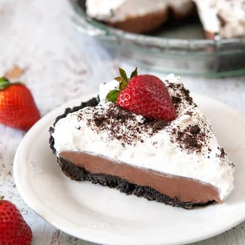 Slice of Chocolate Pudding Pie on white plate