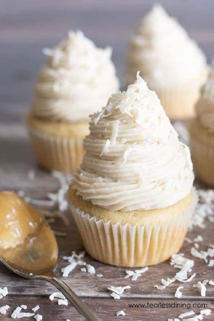 Lemon filled cupcakes on a wooden board