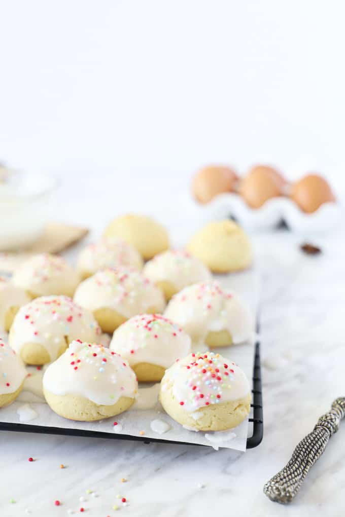 Anise cookies on parchment on a cooling rack