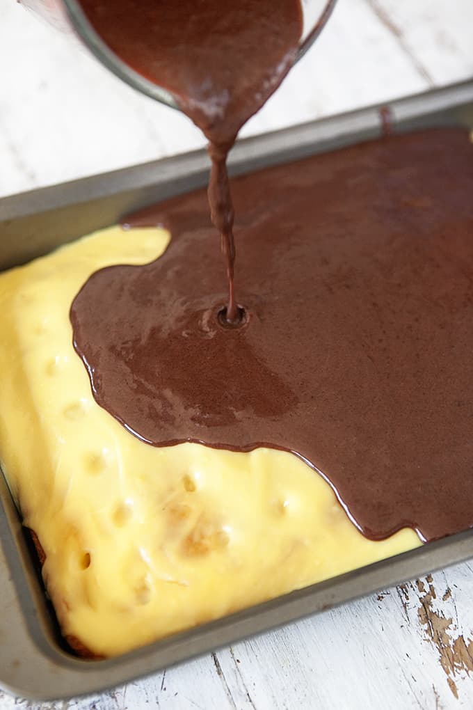 Pouring Chocolate Ganache on poke cake