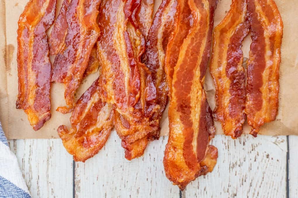 Close up of crispy cooked bacon on a paper bag