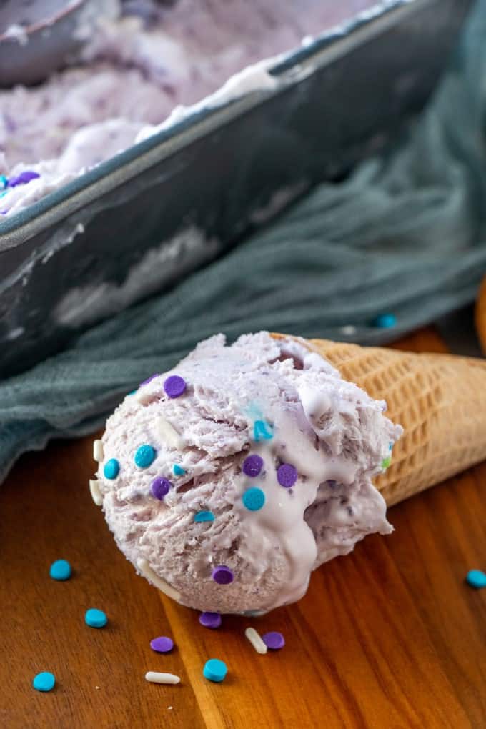 Ube ice cream lying down on a wooden surface. 