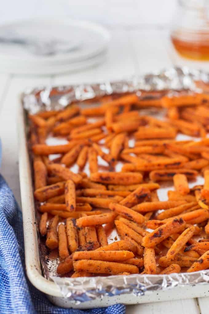 Roasted carrots on a foil lined baking sheet