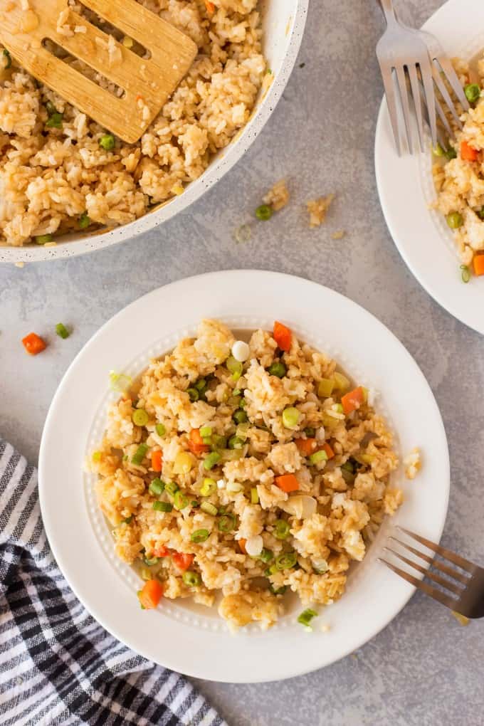 Pan and two plates with fried rice