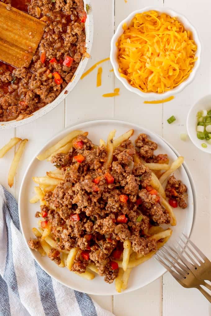 Chili on fries with cheese in a bowl