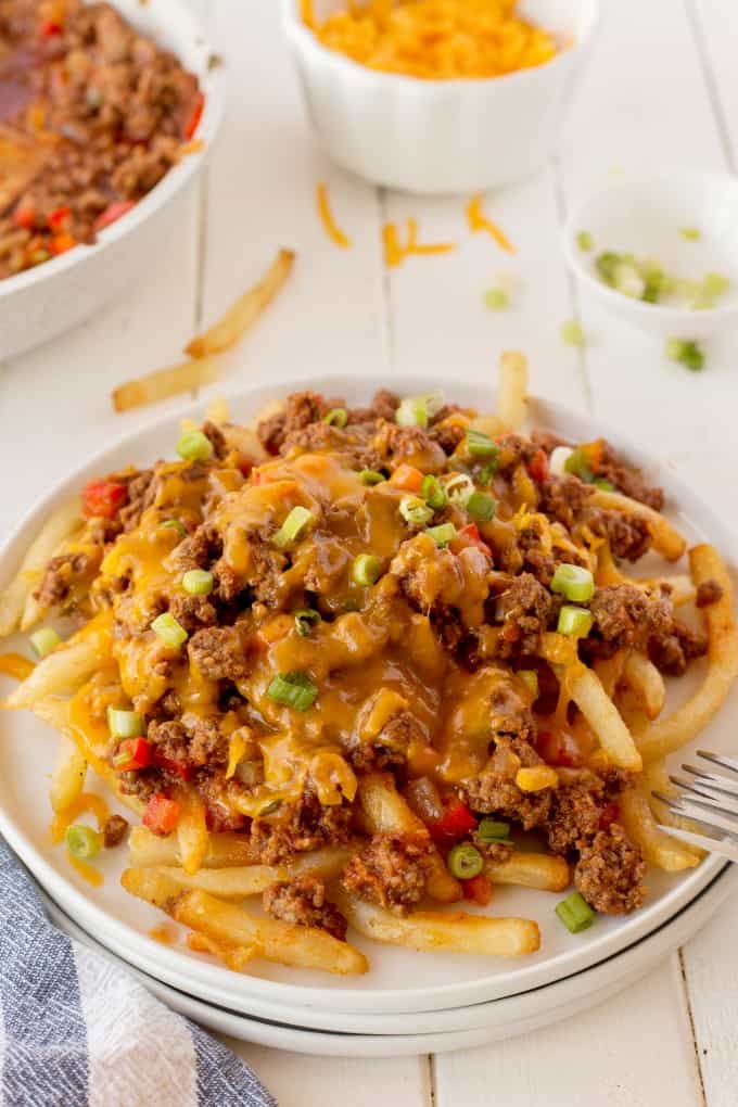 Chili Cheese Fries on a white plate