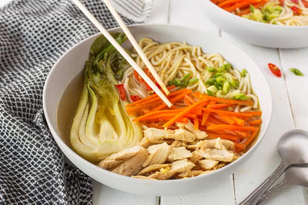 Bowl of Chinese Chicken Noodle Soup with chopsticks