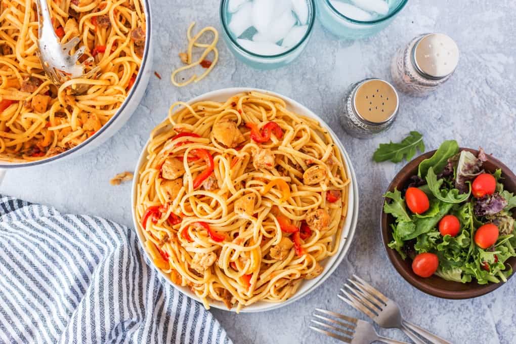 Overhead shot of pasta and a salad 