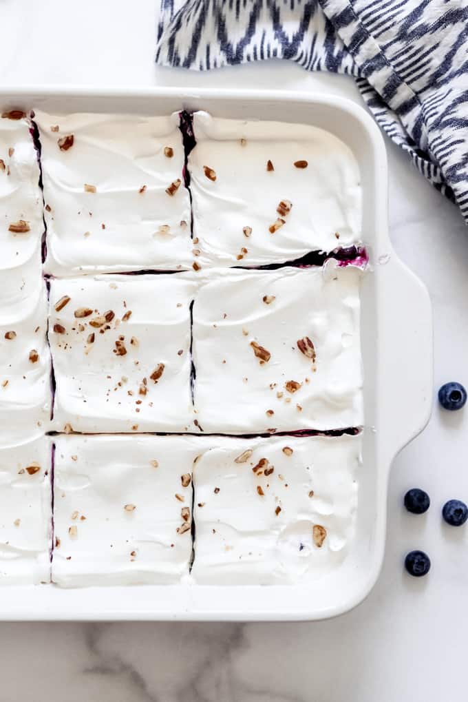 Blueberry delight - a sliced no-bake blueberry dessert in a white dish.