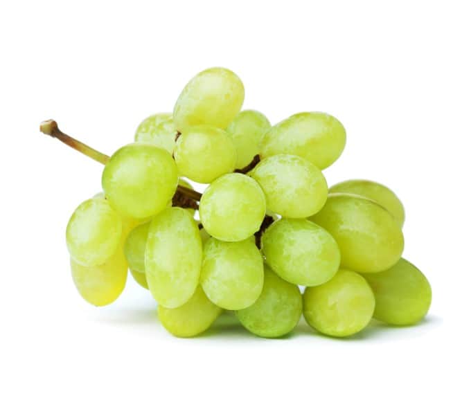 Fresh green grapes. Isolated on white