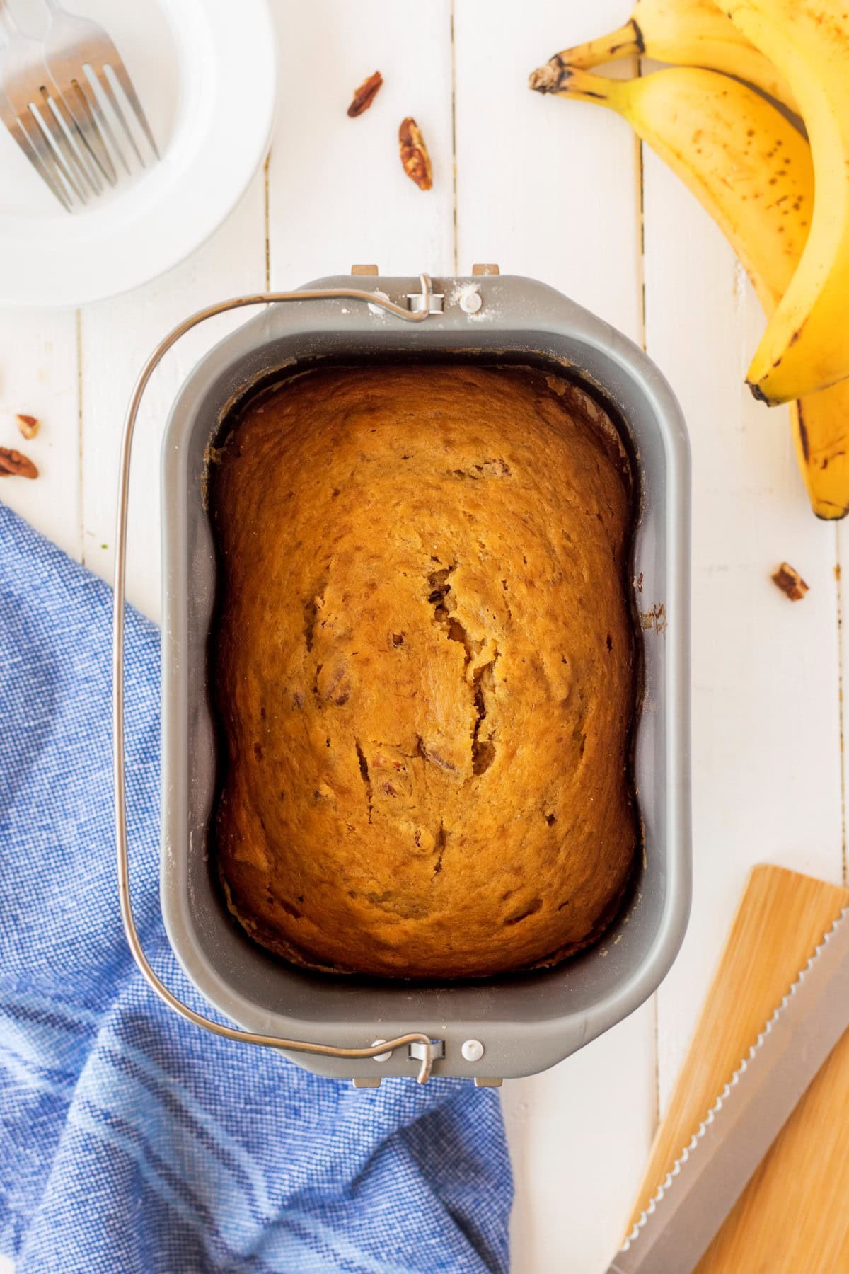 Overhead shot of banana bread in a bread machine pan.