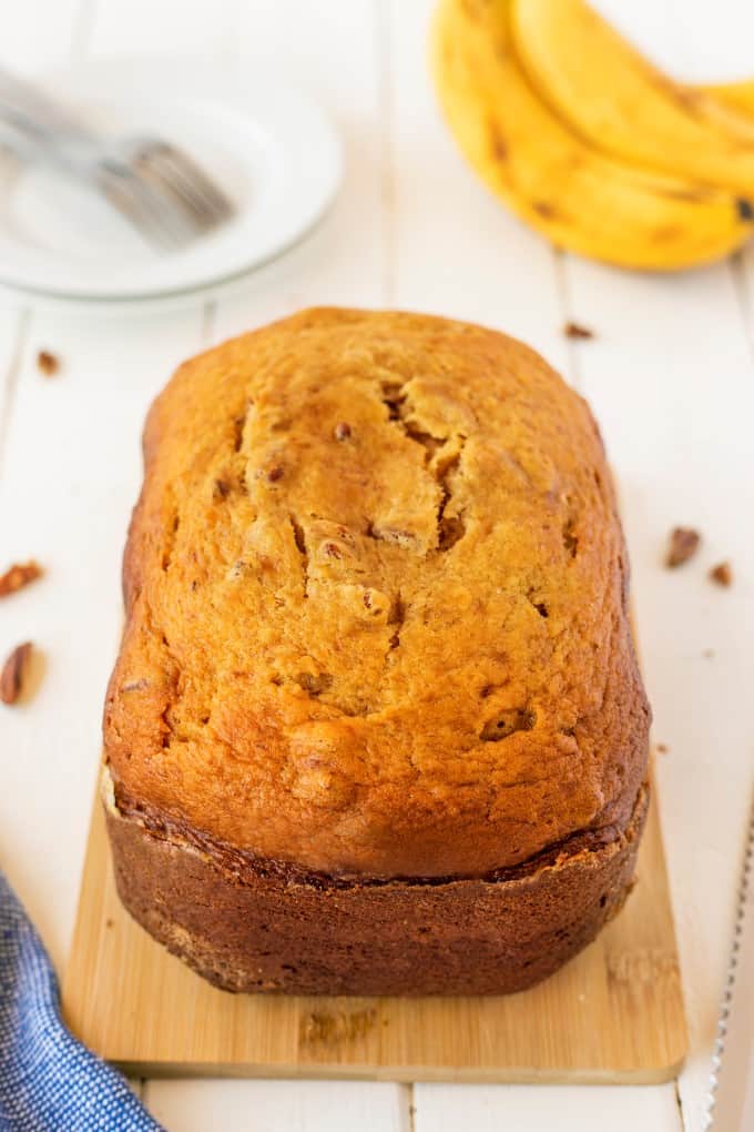 Loaf of Bread Machine Banana Bread on a bread board.