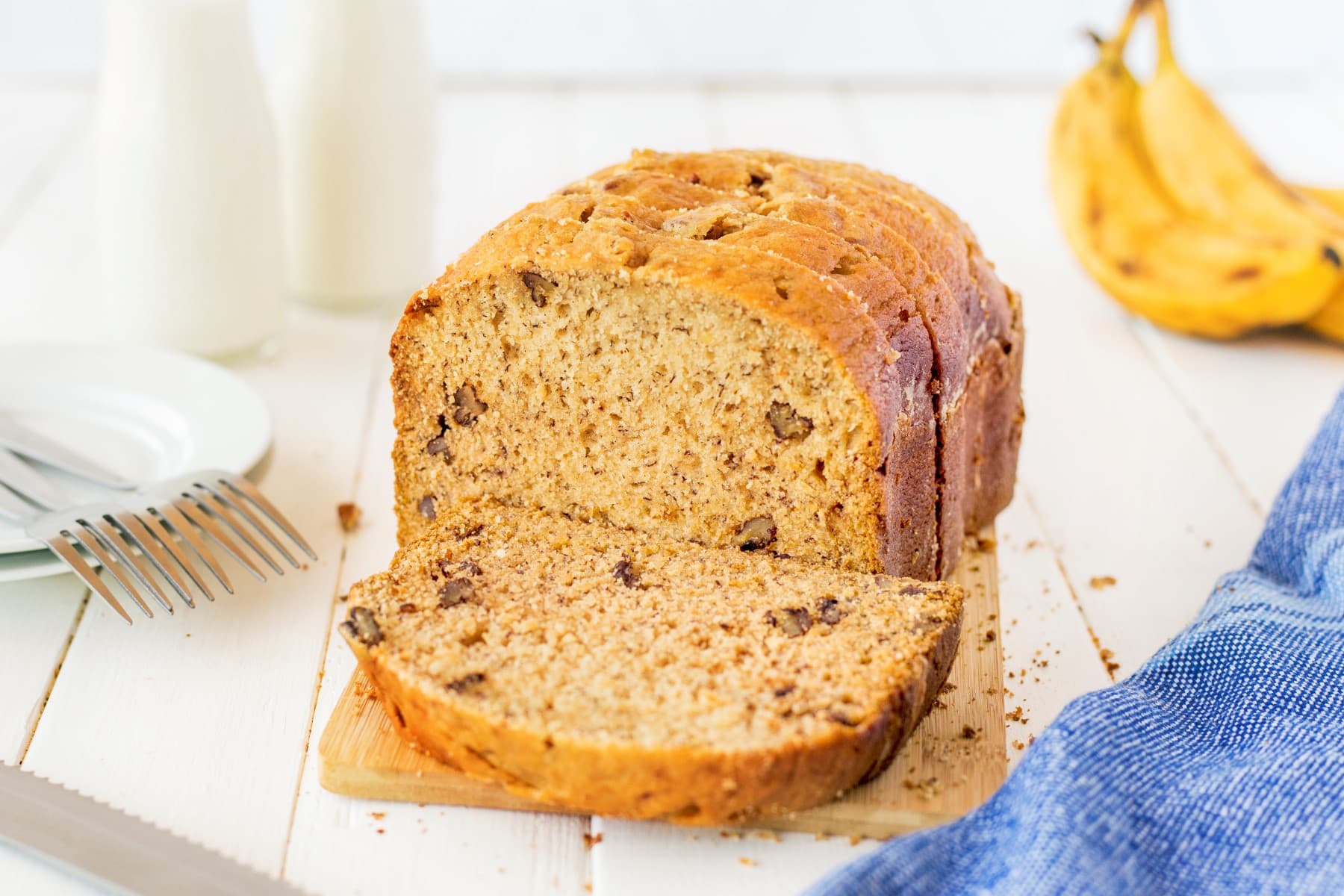 Banana Bread sliced on a bread board.