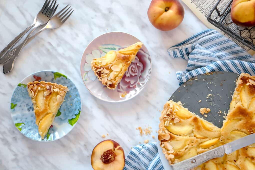 Overhead shot of pie slices and peach pie